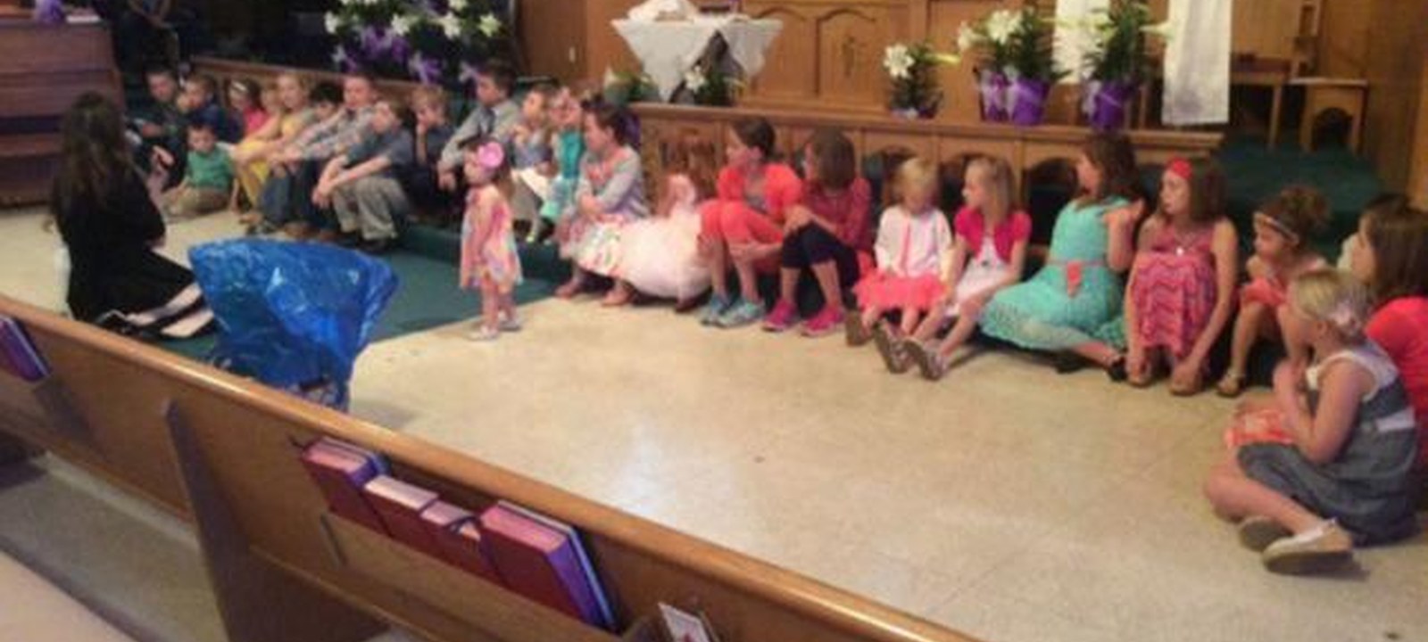 Children gathered at the front of the sanctuary