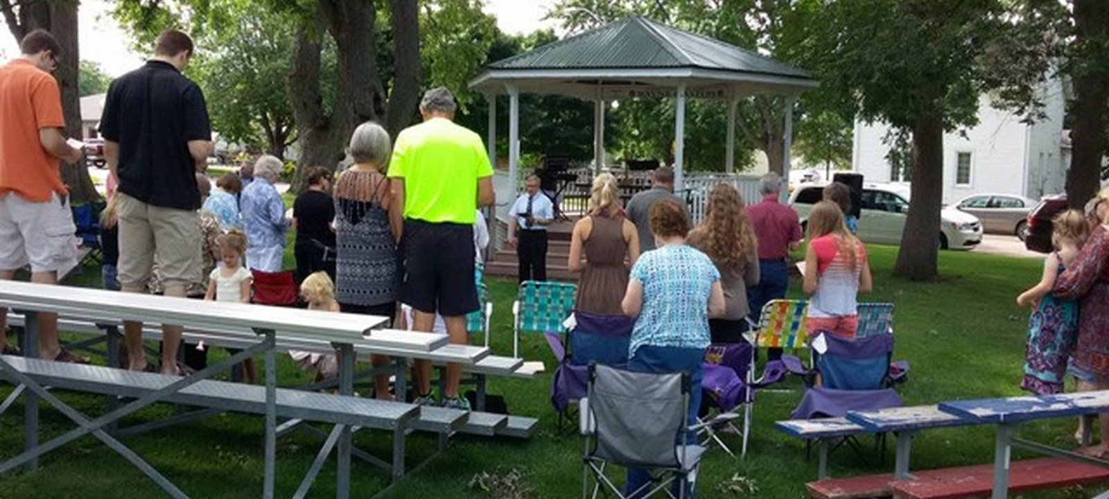 Church family gathering for outdoor worship